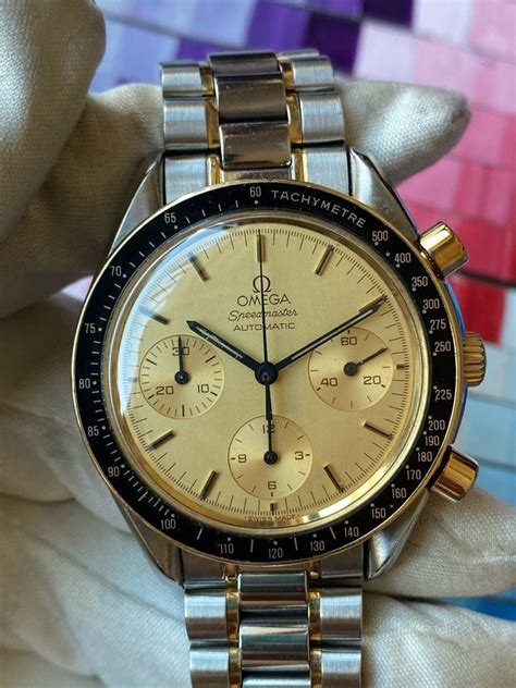 omega speedmaster champagne dial|pricing difference between omega speedmaster.